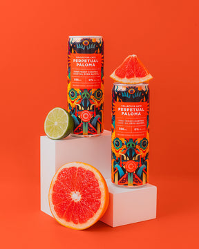 Perpetual Paloma cans displayed with grapefruit